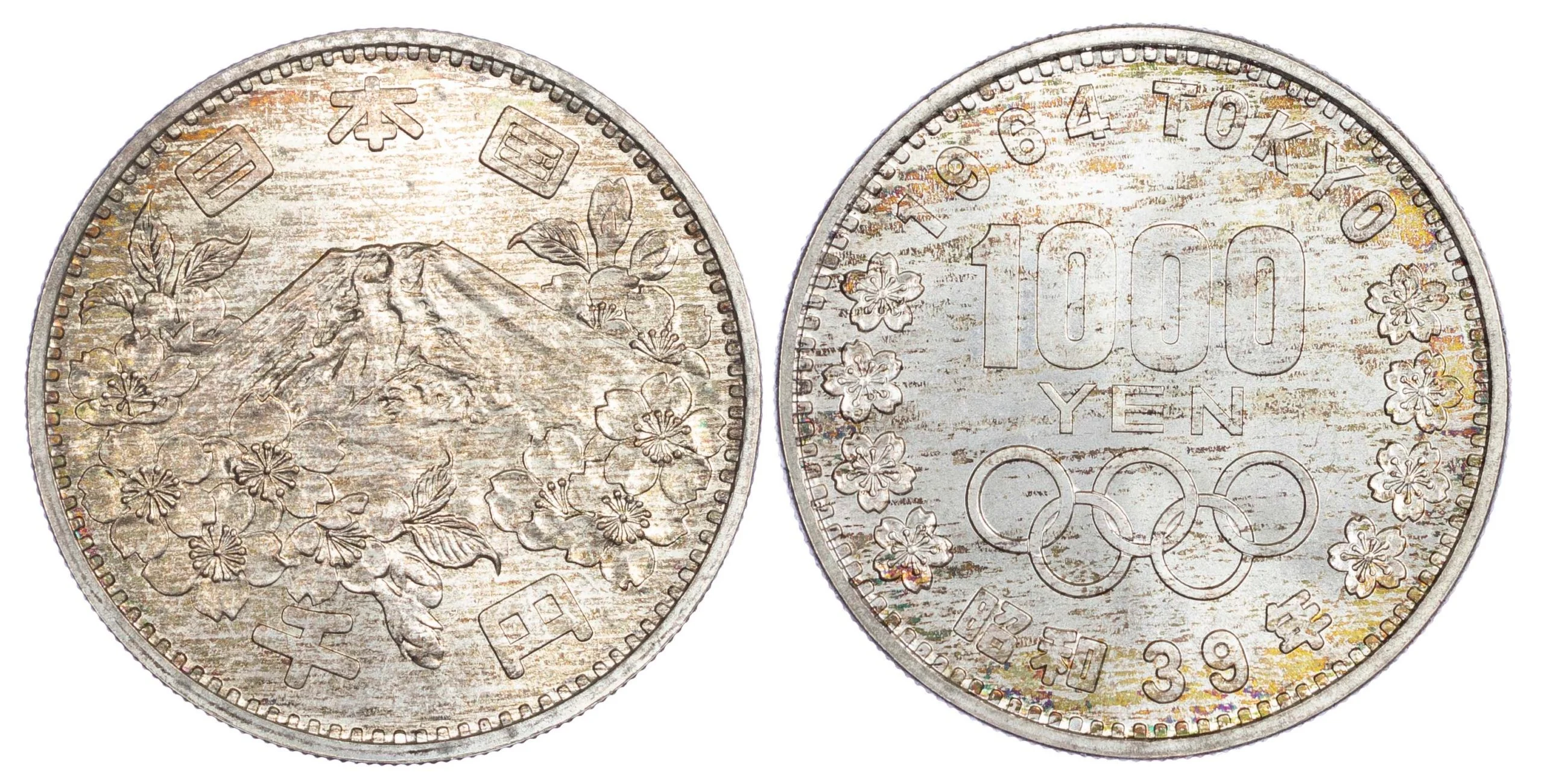Japan Showa commemorative coin for the 1964 summer Olympic games with toning. Mount fuji on the obverse, the olympic rings on the reverse.