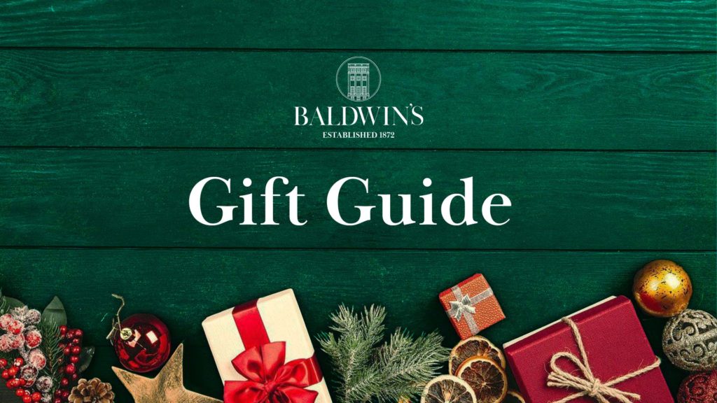 Christmas presents and decorations with the words 'Gift Guide' and the Baldwins logo.